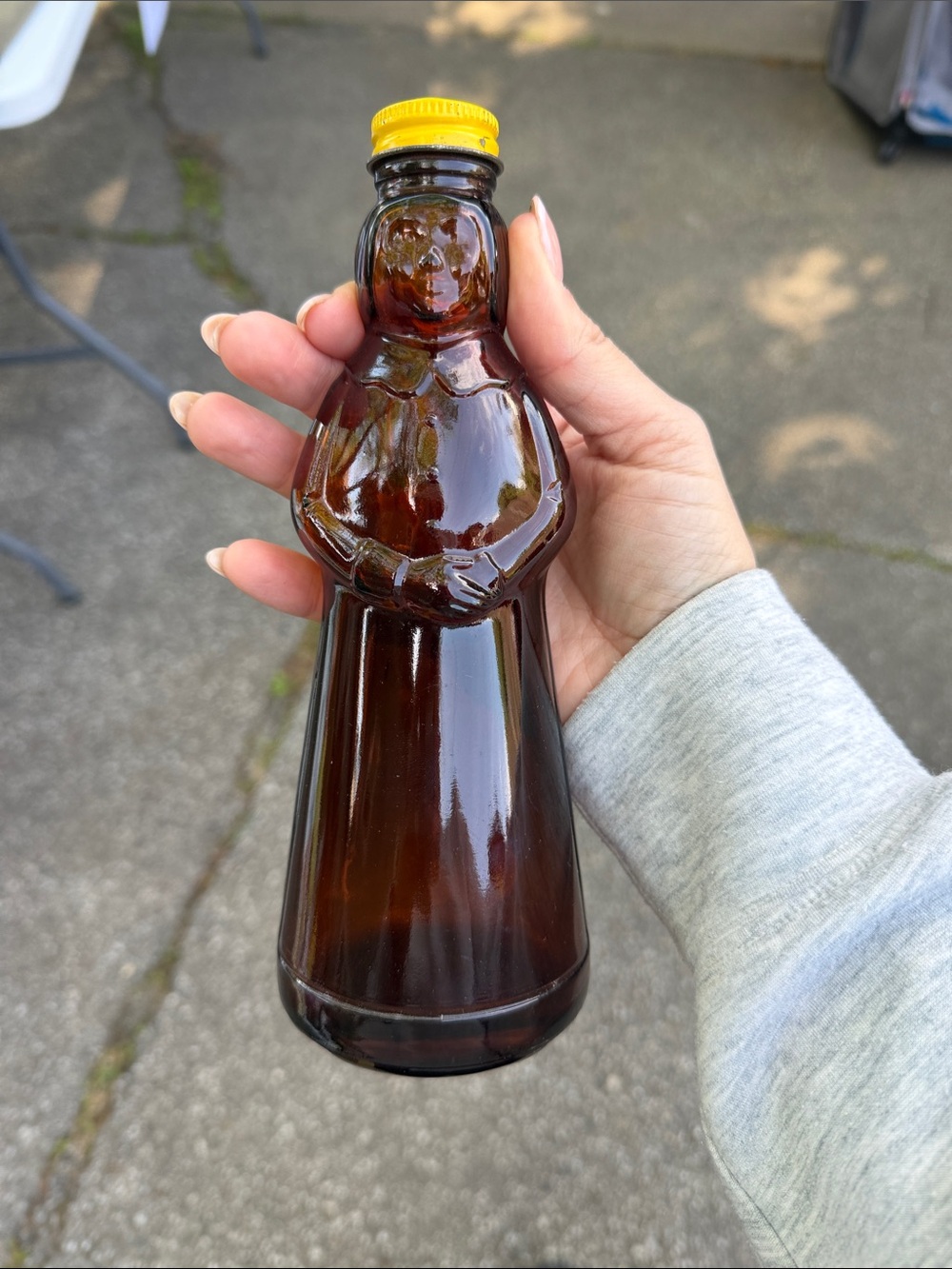 Vintage Amber Glass Figural Bottle with Yellow Cap